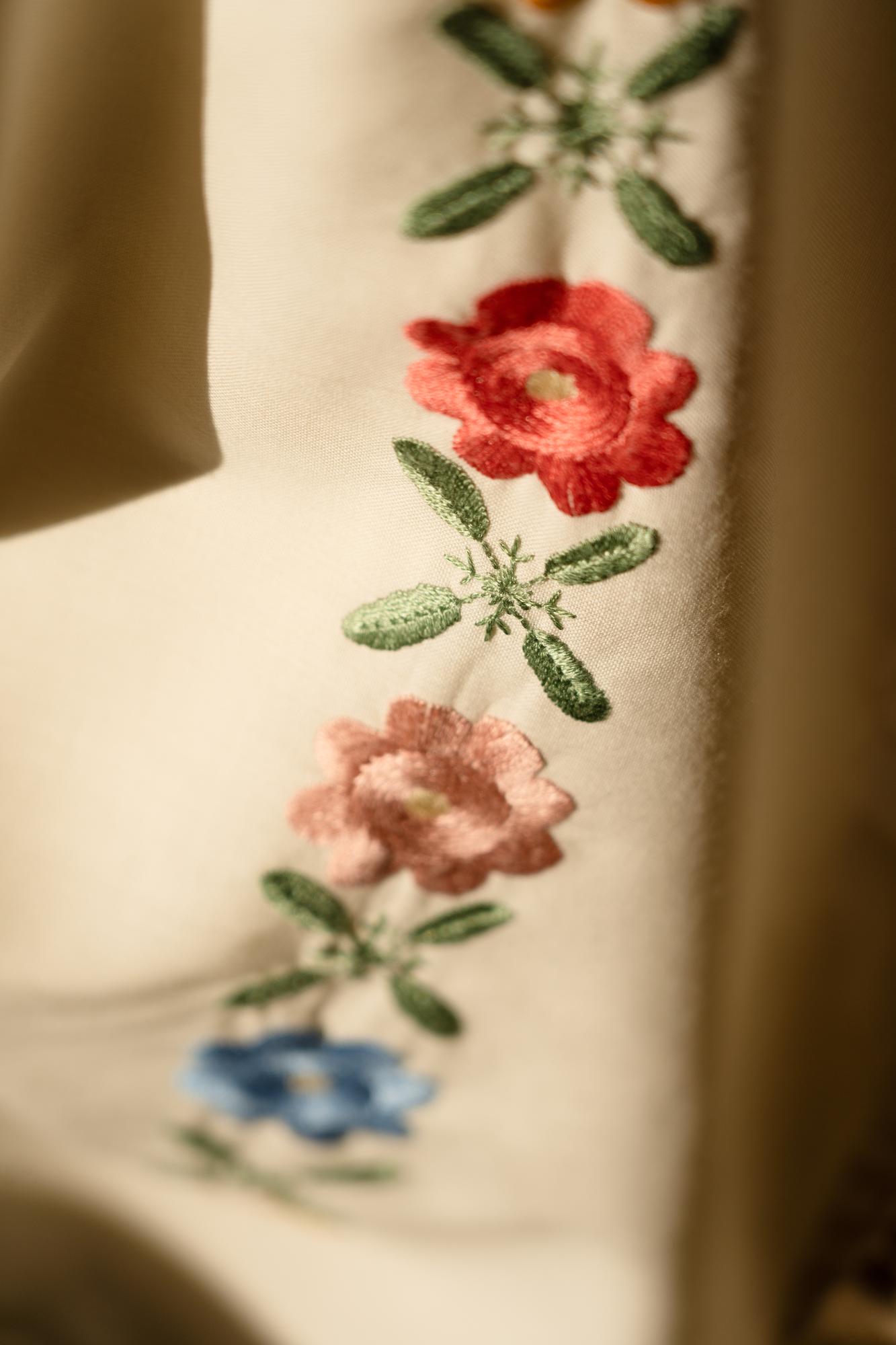close-up of embroidered linen with floral motif